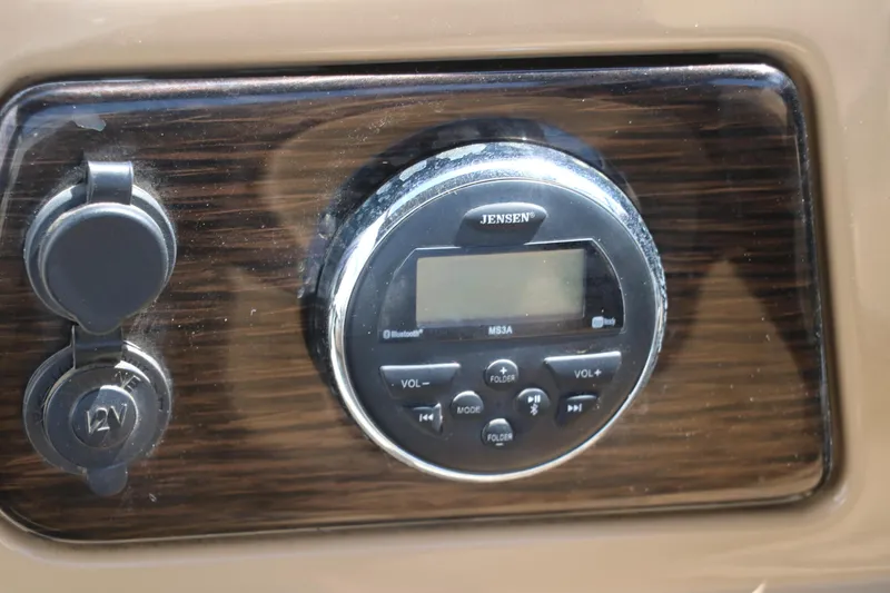Slide: The Image of 2019 Lowe SS210 boat stereo system with Jensen controls and 12V outlet. - 32
