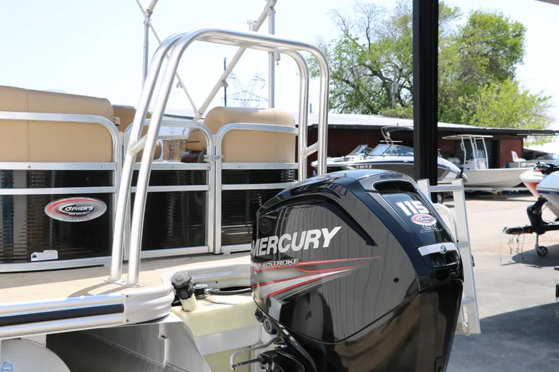Slide: The Image of 2019 Lowe SS210 pontoon boat with Mercury 115 outboard motor at a marina. - 6