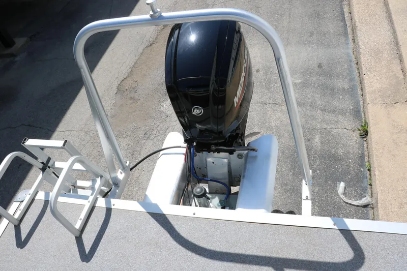 Slide: The Image of 2015 Sun Tracker Party Barge 20 DLX with outboard motor and ladder, viewed from above. - 20