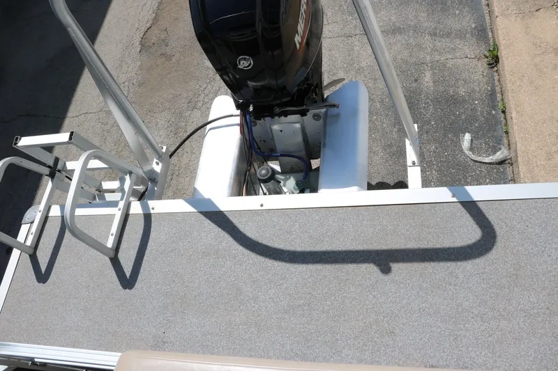 Slide: The Image of 2015 Sun Tracker Party Barge 20 DLX with outboard motor and swim ladder. - 21