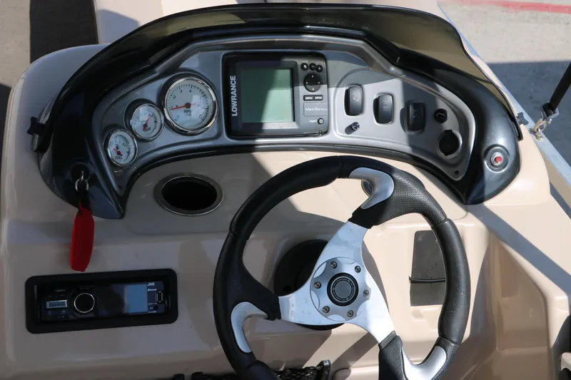 Slide: The Image of Steering console of 2015 Sun Tracker Party Barge 20 DLX with gauges and controls. - 24