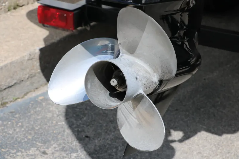 Slide: The Image of Propeller of a 2015 Sun Tracker Party Barge 20 DLX on a concrete surface. - 5