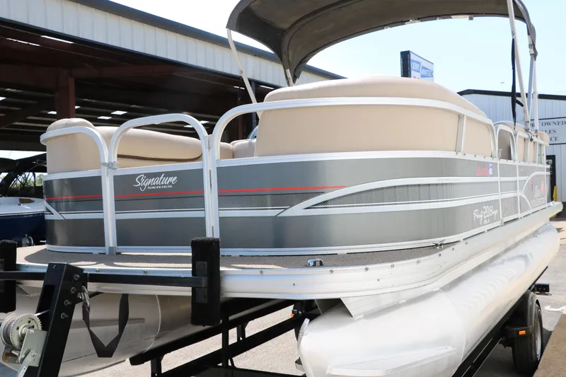 Slide: The Image of 2015 Sun Tracker Party Barge 20 DLX pontoon boat on trailer. - 8