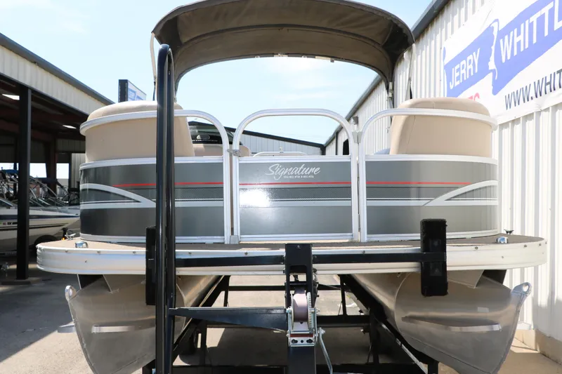 Slide: The Image of 2015 Sun Tracker Party Barge 20 DLX pontoon boat on trailer, rear view. - 9