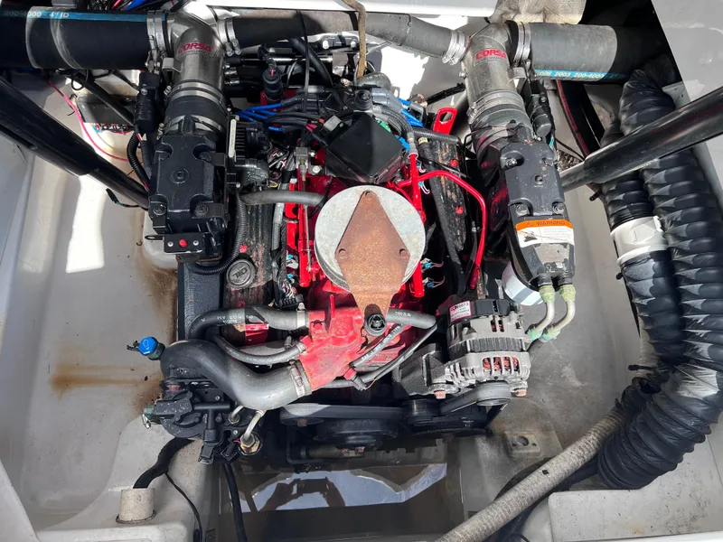 Slide: The Image of Engine of 2004 Four Winns 240 Horizon boat, showcasing detailed components and wiring. - 13