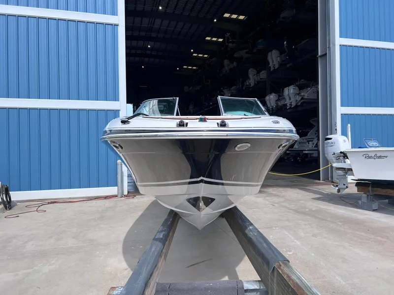 Slide: The Image of 2004 Four Winns 240 Horizon boat in storage facility, front view. - 3