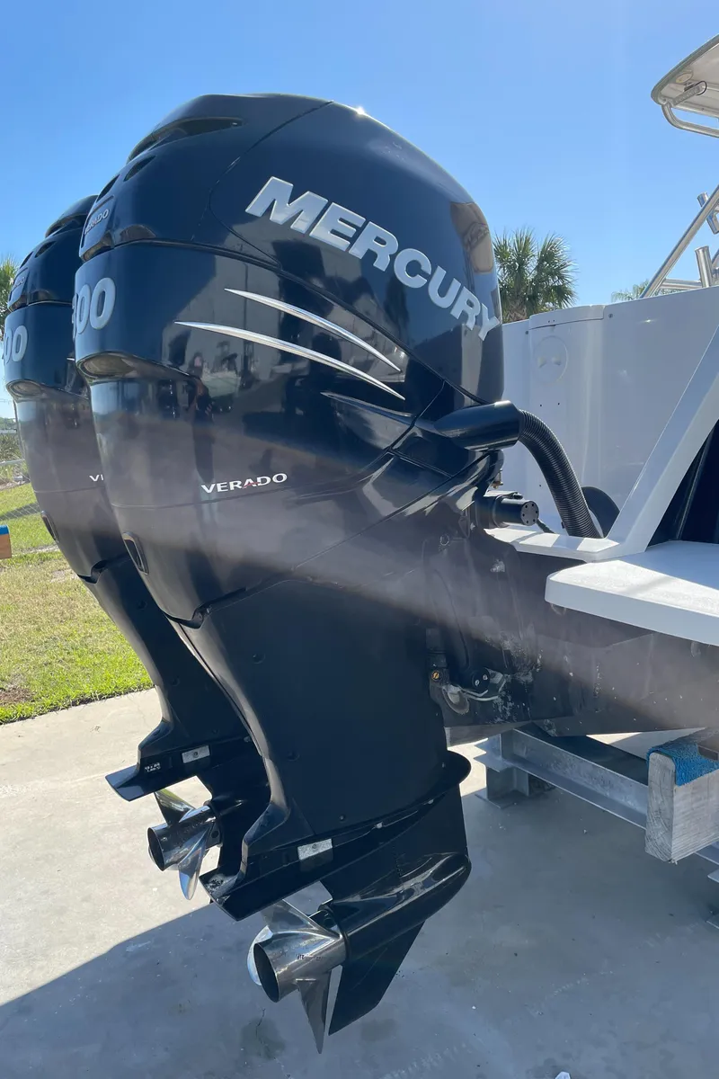 Slide: The Image of Twin Mercury Verado outboard engines on a 2008 Intrepid 323 Cuddy boat. - 12