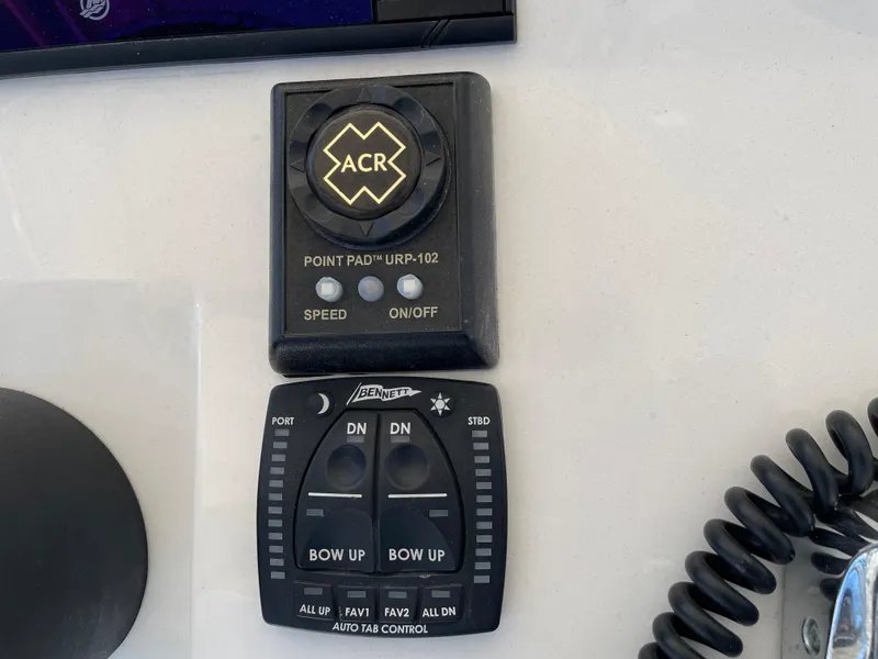 Slide: The Image of Control panel on a 2008 Intrepid 323 Cuddy boat with ACR and Bennett systems. - 34