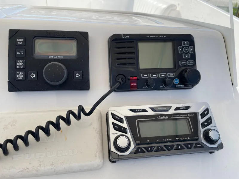 Slide: The Image of Control panel of a 2008 Intrepid 323 Cuddy with radio and navigation equipment. - 36