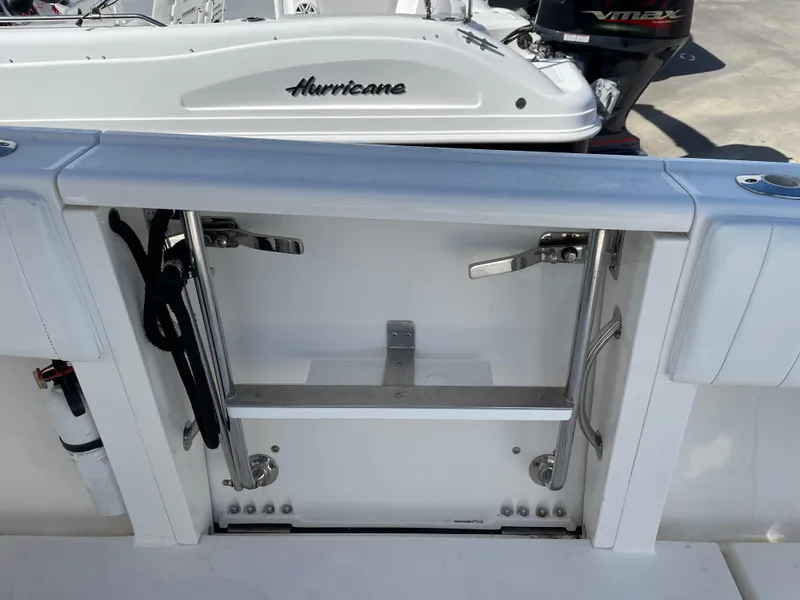Slide: The Image of 2008 Intrepid 323 Cuddy boat with open transom door and visible hardware. - 39