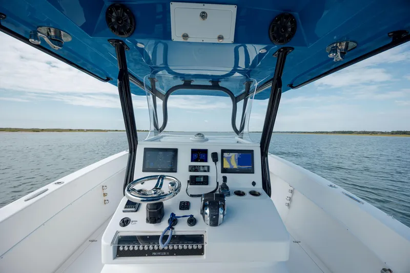 Slide: The Image of Cockpit view of 2020 Prowler 31 boat with navigation equipment and steering wheel. - 16