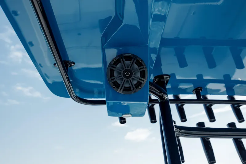 Slide: The Image of Blue Prowler 31 boat roof with speaker, 2020 model, against a clear sky. - 18