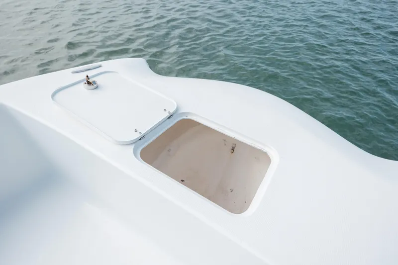 Slide: The Image of Open storage compartment on 2020 Prowler 31 boat, near water surface. - 22