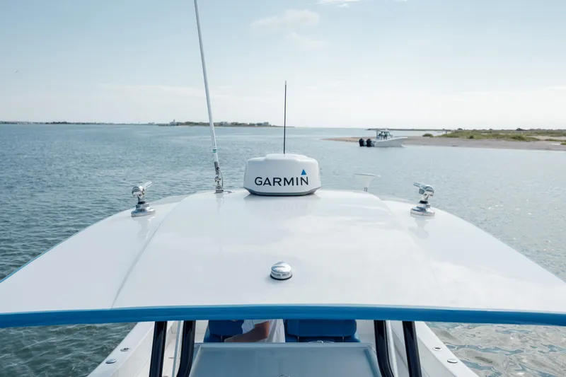Slide: The Image of Prowler 31 boat with Garmin equipment on calm water, 2020 model. - 26