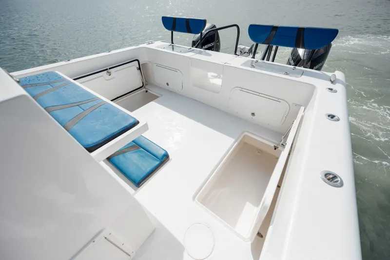 Slide: The Image of 2020 Prowler 31 boat deck with blue seating and storage compartments. - 29