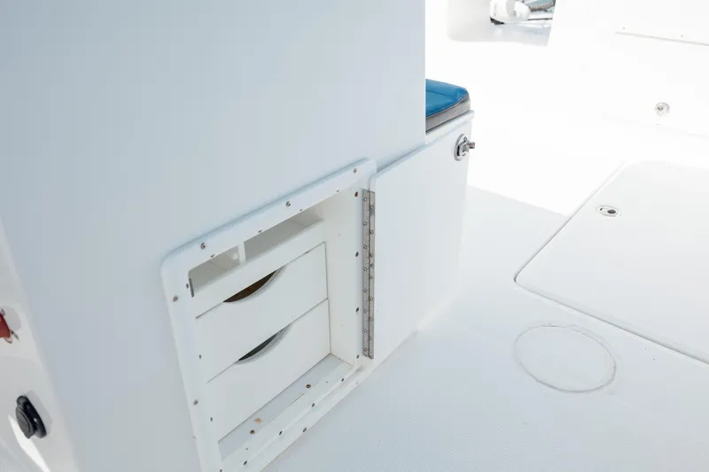 Slide: The Image of 2020 Prowler 31 boat interior with storage compartments and seating. - 31
