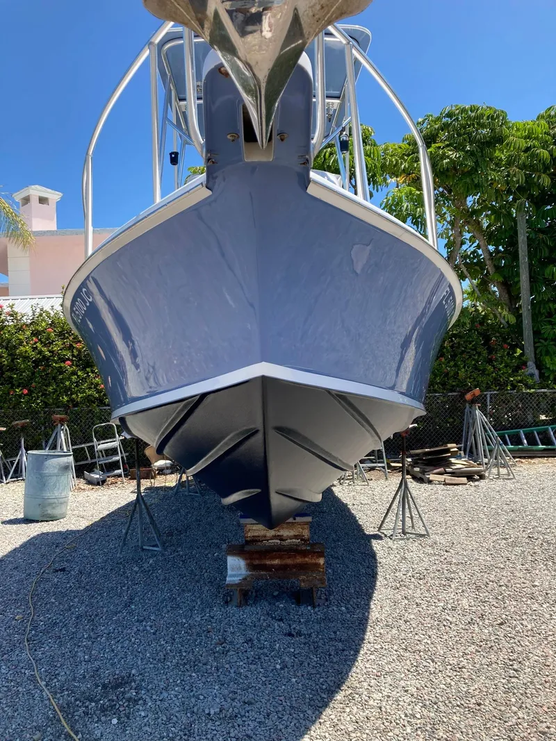 Slide: The Image of 1974 Bertram 31 Flybridge Cruiser on dry dock, viewed from the front. - 16