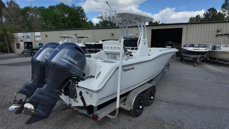 Slide: The Image of 2020 Tidewater 252 CC Adventure boat with dual Yamaha engines on a trailer. - 17