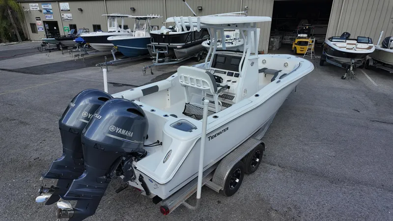Slide: The Image of 2020 Tidewater 252 CC Adventure boat with dual Yamaha engines on a trailer. - 18