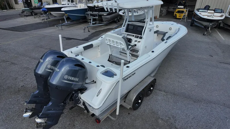 Slide: The Image of 2020 Tidewater 252 CC Adventure boat with dual Yamaha engines on a trailer. - 19