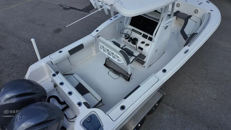 Slide: The Image of 2020 Tidewater 252 CC Adventure boat interior with dual Yamaha engines, spacious seating, and modern controls. - 20