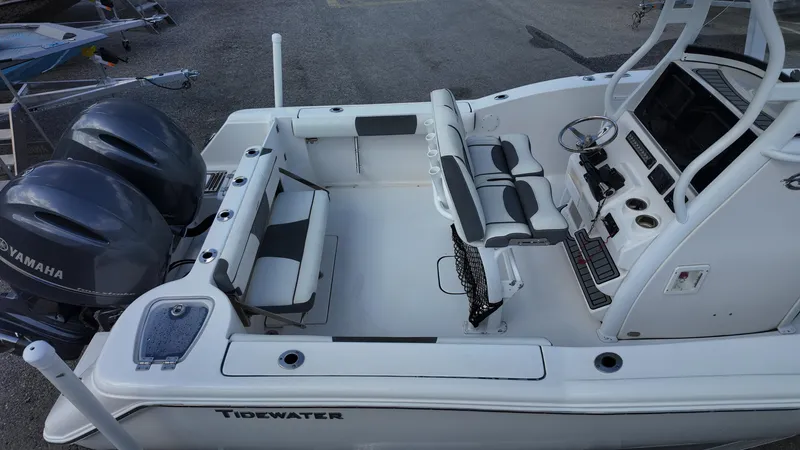 Slide: The Image of 2020 Tidewater 252 CC Adventure boat with dual Yamaha engines, spacious seating, and modern console. - 23