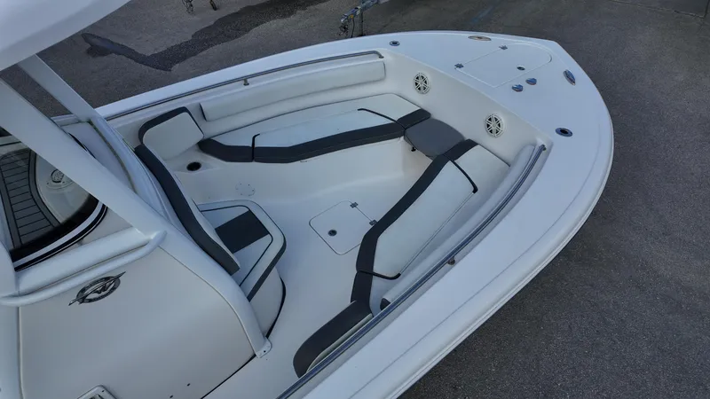 Slide: The Image of 2020 Tidewater 252 CC Adventure boat interior with seating and storage compartments. - 24