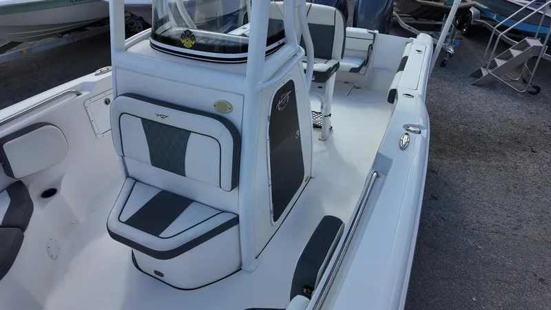 Slide: The Image of 2020 Tidewater 252 CC Adventure boat interior with seating and console. - 28