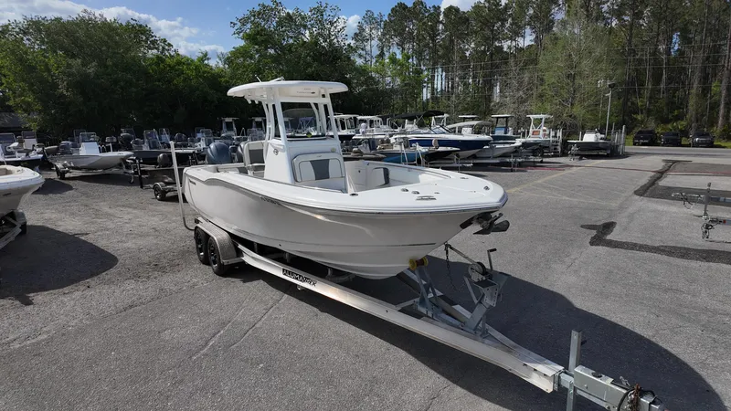 Slide: The Image of 2020 Tidewater 252 CC Adventure boat on trailer in outdoor lot. - 3