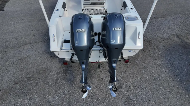 Slide: The Image of 2020 Tidewater 252 CC Adventure with dual 150 horsepower outboard engines, rear view. - 36