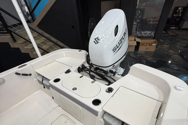 Slide: The Image of 2024 Carolina Skiff 21 LS boat with Suzuki outboard motor in showroom. - 11