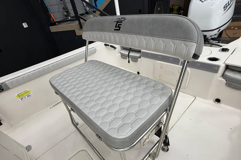 Slide: The Image of 2024 Carolina Skiff 21 LS boat seat with hexagonal pattern and sleek design. - 12