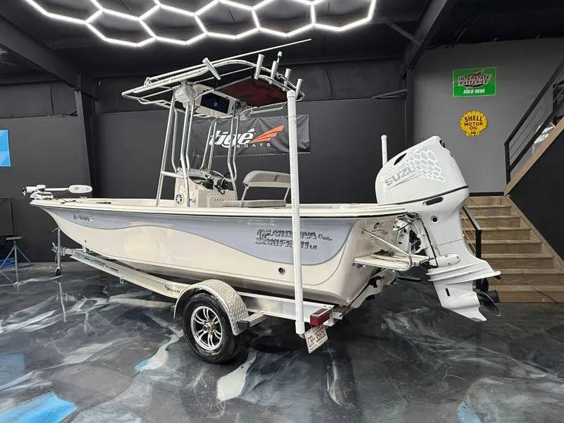 Slide: The Image of 2024 Carolina Skiff 21 LS boat with outboard motor in showroom. - 3