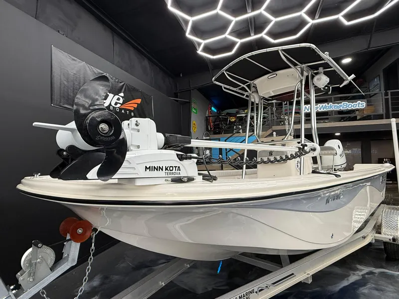 Slide: The Image of 2024 Carolina Skiff 21 LS boat with Minn Kota trolling motor in showroom. - 4