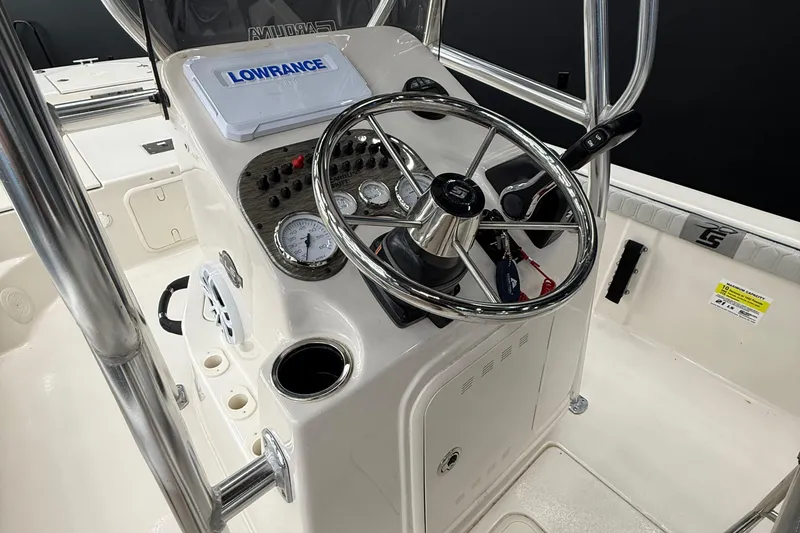 Slide: The Image of 2024 Carolina Skiff 21 LS boat console with steering wheel and Lowrance display. - 8