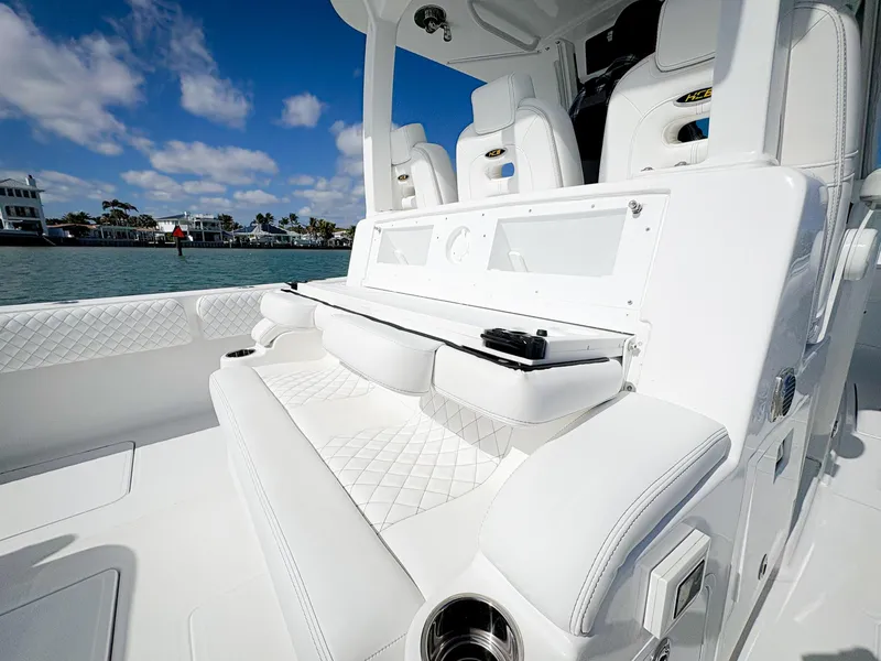 Slide: The Image of 2023 HCB 39 Speciale boat interior with luxurious white seating and ocean view. - 18
