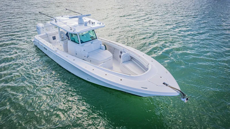 Slide: The Image of 2023 HCB 39 Speciale boat on calm water, showcasing sleek design and modern features. - 5