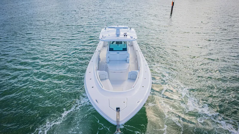 Slide: The Image of 2023 HCB 39 Speciale boat cruising on open water, aerial view. - 6
