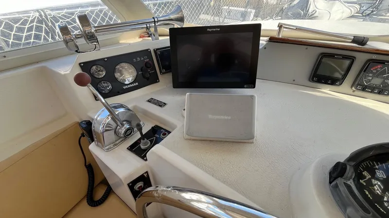 Slide: The Image of 1996 Amel Super Maramu-53 yacht cockpit with navigation instruments and controls. - 14