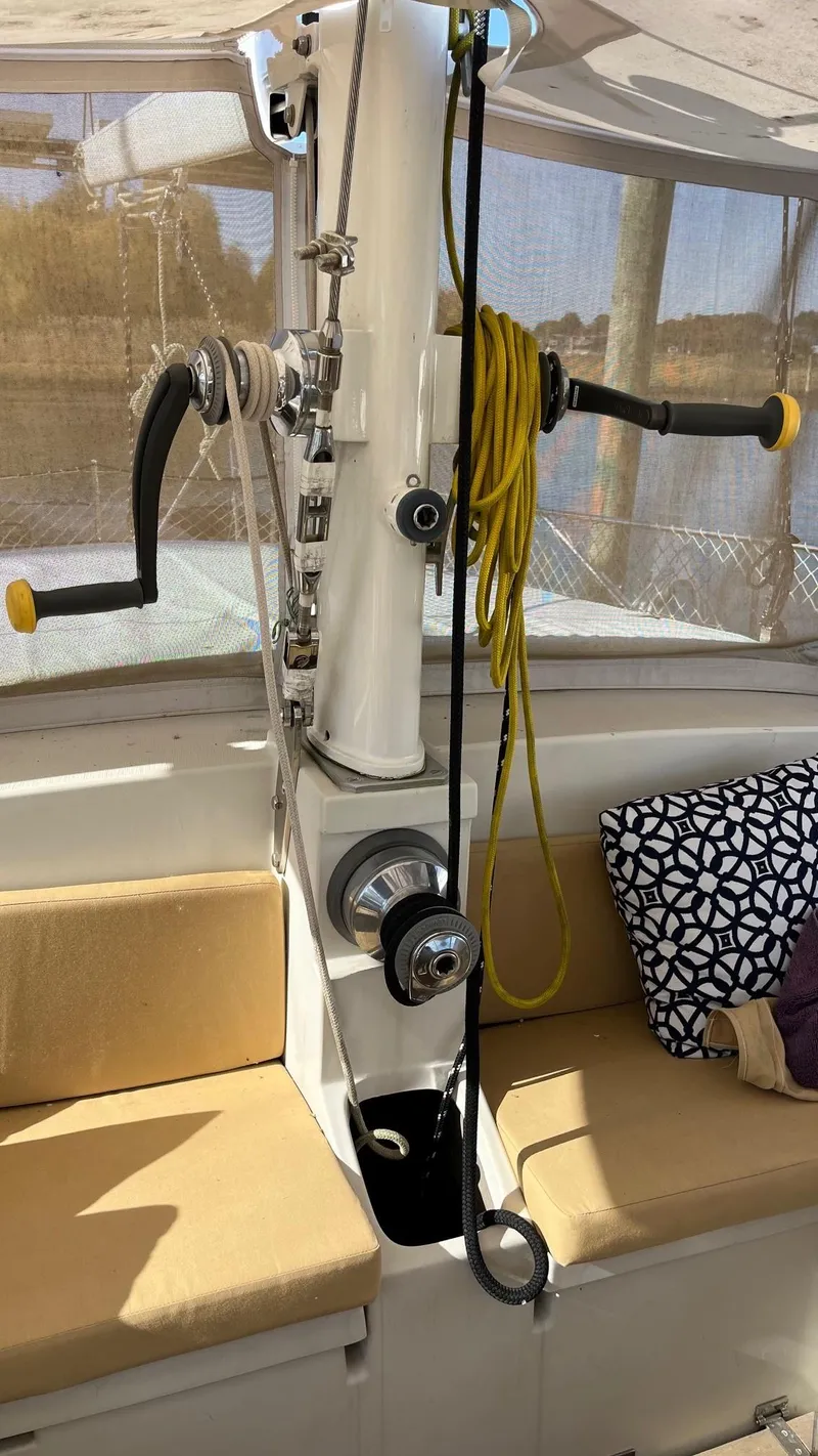 Slide: The Image of Interior of 1996 Amel Super Maramu-53 sailboat with winches and seating area. - 17