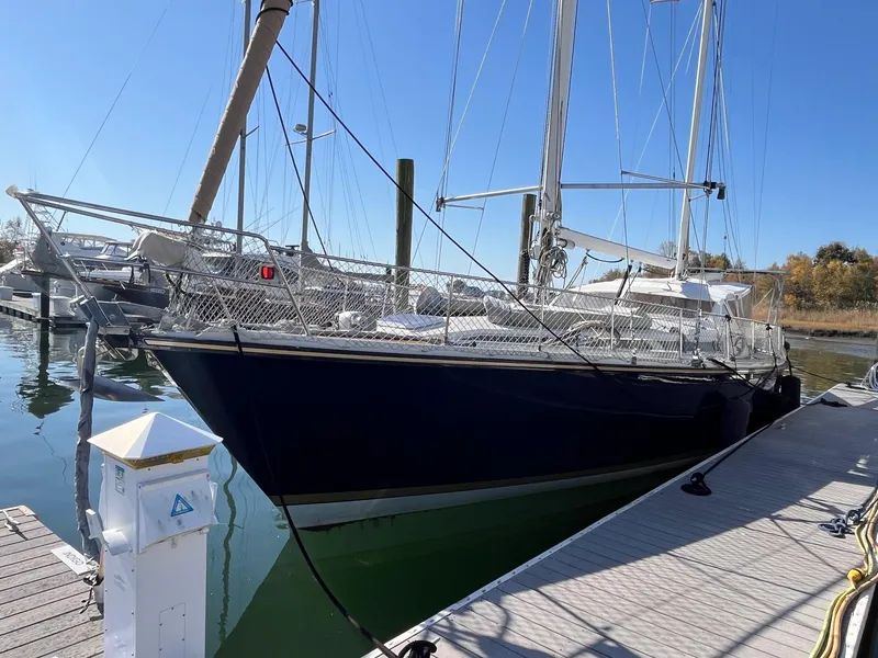 Slide: The Image of Sailboat Amel Super Maramu-53, 1996 model, docked at marina under clear blue sky. - 2