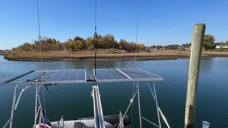 Slide: The Image of Sailboat with solar panels on calm water, Amel Super Maramu-53, 1996 model. - 20