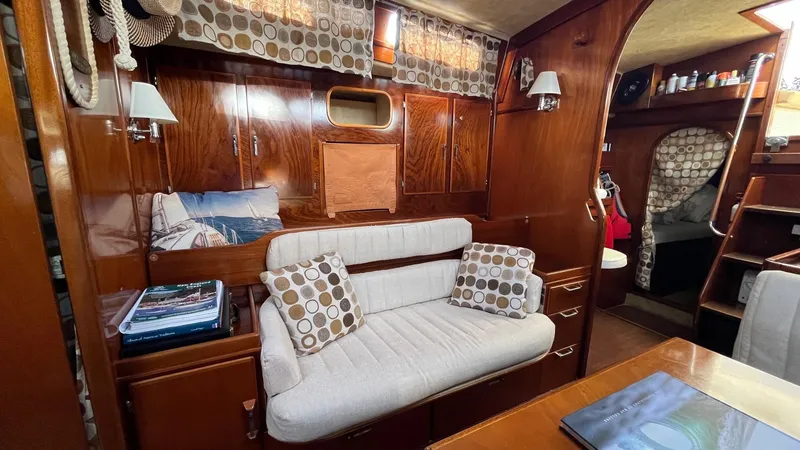 Slide: The Image of Interior of 1996 Amel Super Maramu-53 yacht with cozy seating and wooden finish. - 27