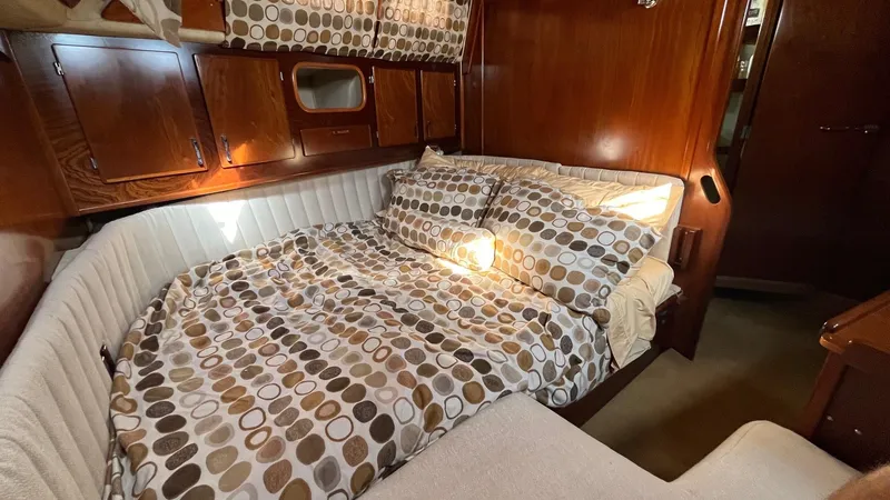 Slide: The Image of Cozy cabin interior of 1996 Amel Super Maramu-53 with patterned bedding and wooden accents. - 39