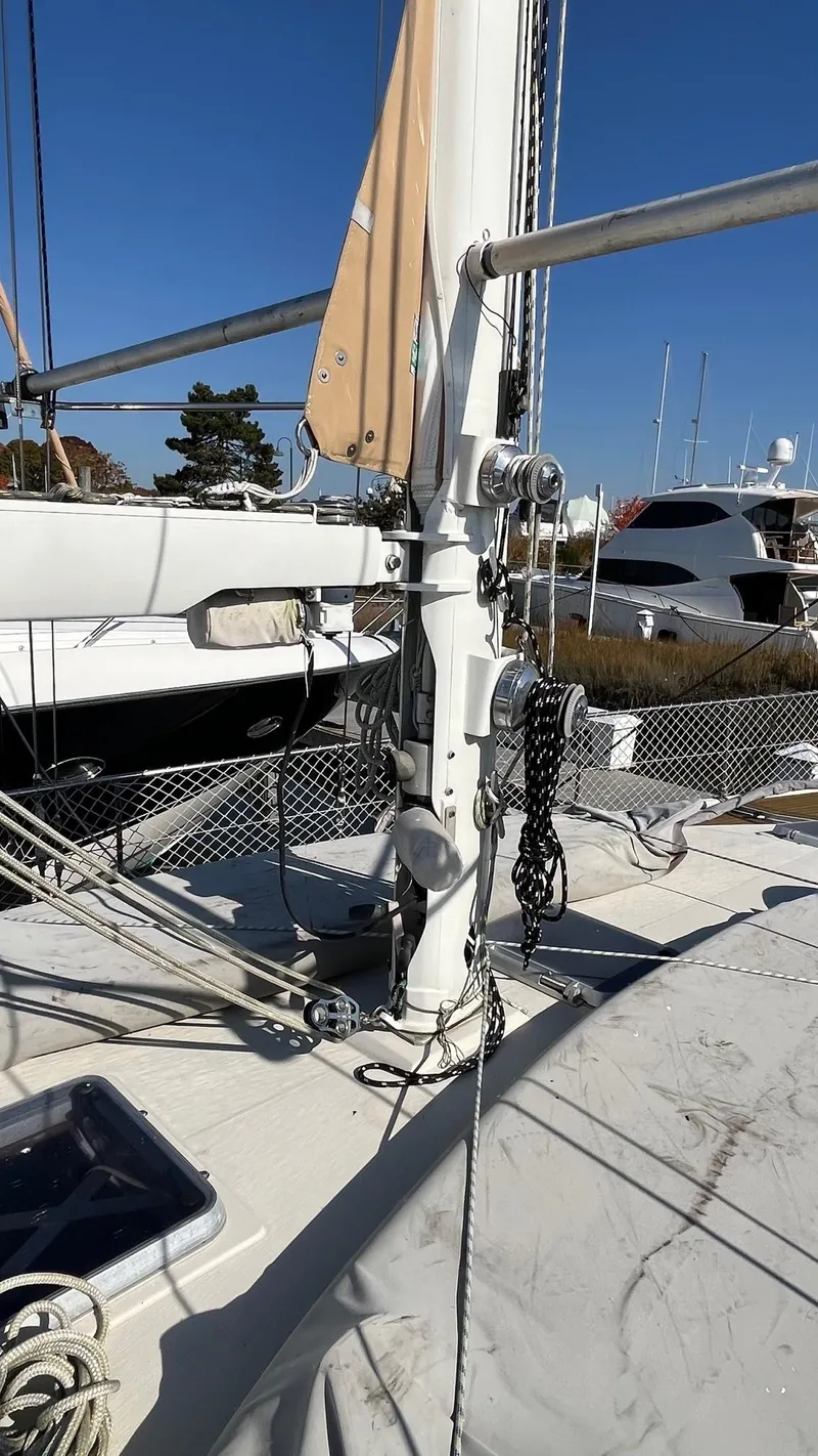 Slide: The Image of Sailboat deck of 1996 Amel Super Maramu-53 with rigging and clear blue sky. - 7