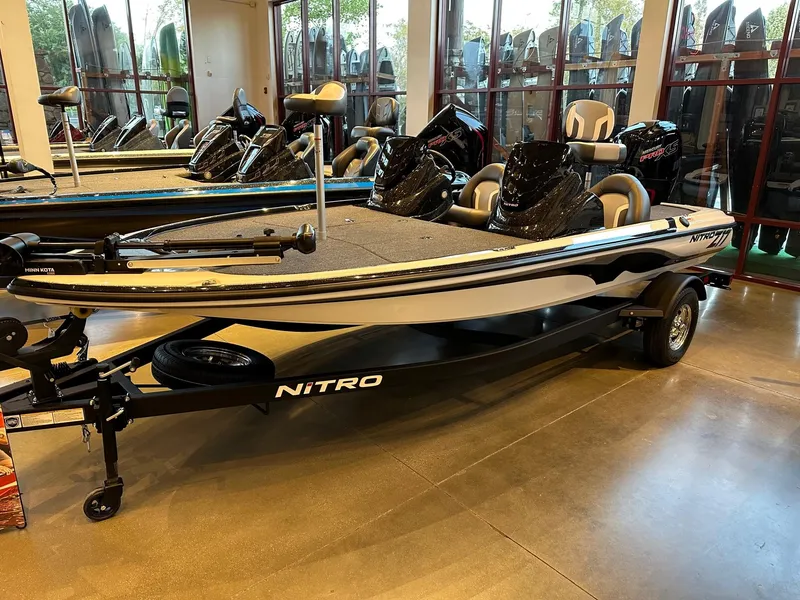 Slide: The Image of 2025 Nitro Z17 boat displayed indoors, featuring sleek design and modern seating. - 1