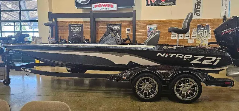 The Image of 2025 Nitro Z21 XL Pro boat displayed indoors on a trailer. - 0