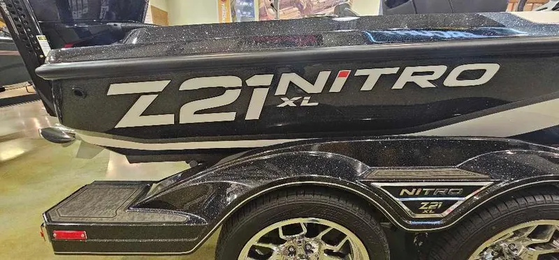 Slide: The Image of 2025 Nitro Z21 XL Pro boat trailer with stylish wheels and branding. - 2