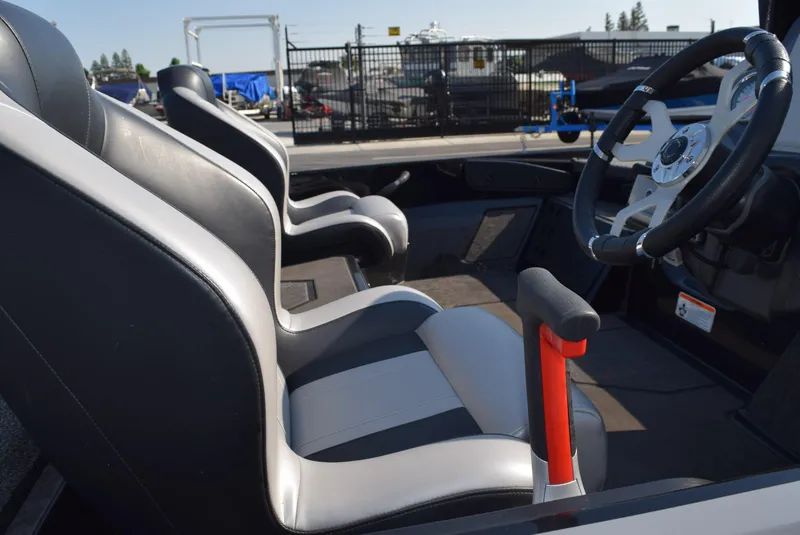 Slide: The Image of Interior of 2025 Nitro Z20 XL Pro boat with sleek seating and steering wheel. - 7