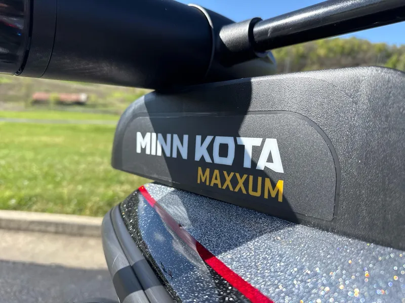 Slide: The Image of 2025 Nitro Z19 boat with red and gray seats on a sunny day. - 6